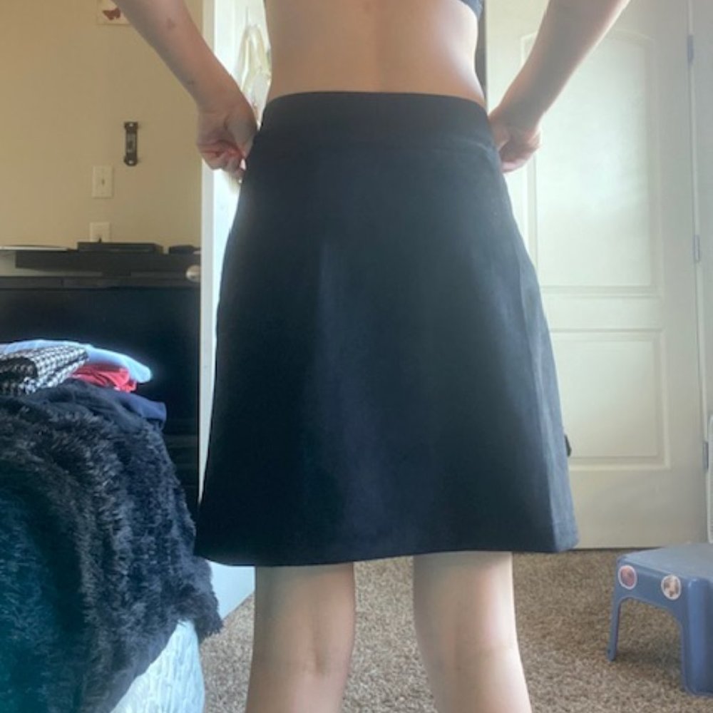 Black skirt with gold button and zippers